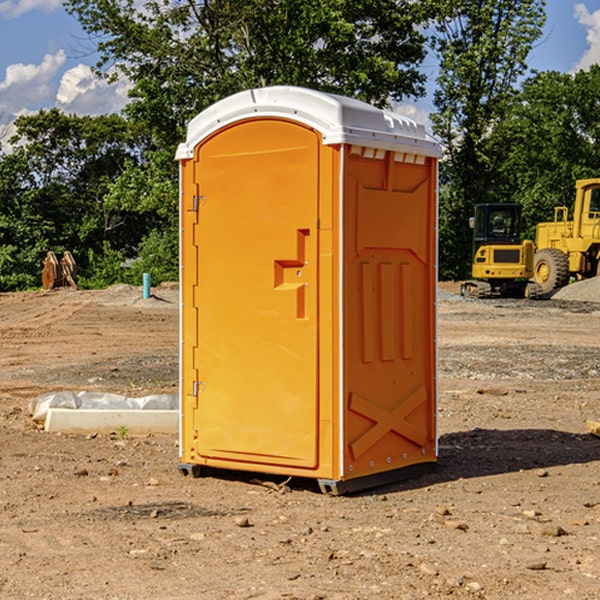 what is the cost difference between standard and deluxe portable toilet rentals in Guston